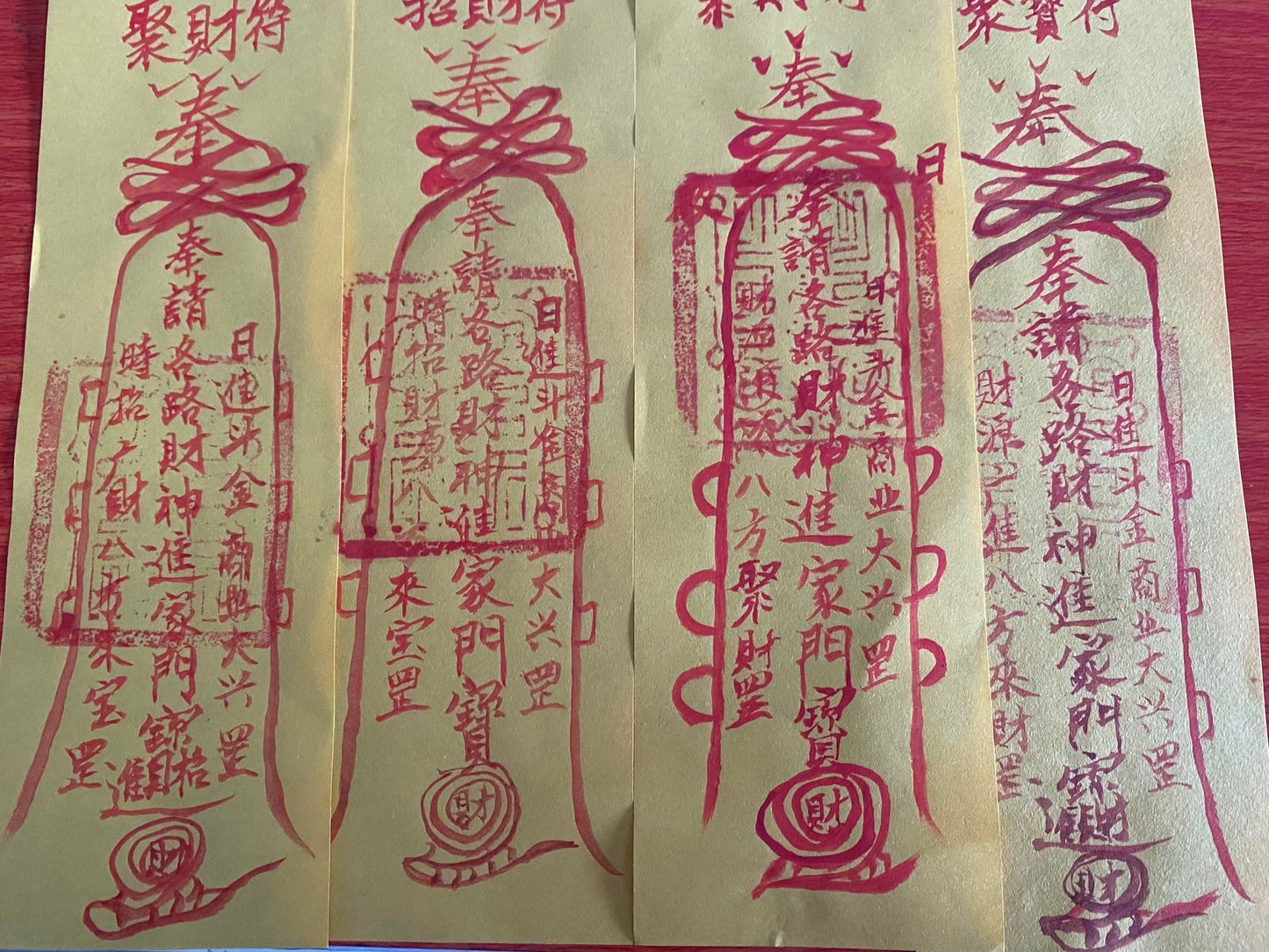 The master hand-painted cinnabar yellow talismans attract wealth, bring blessings, and ensure peace.