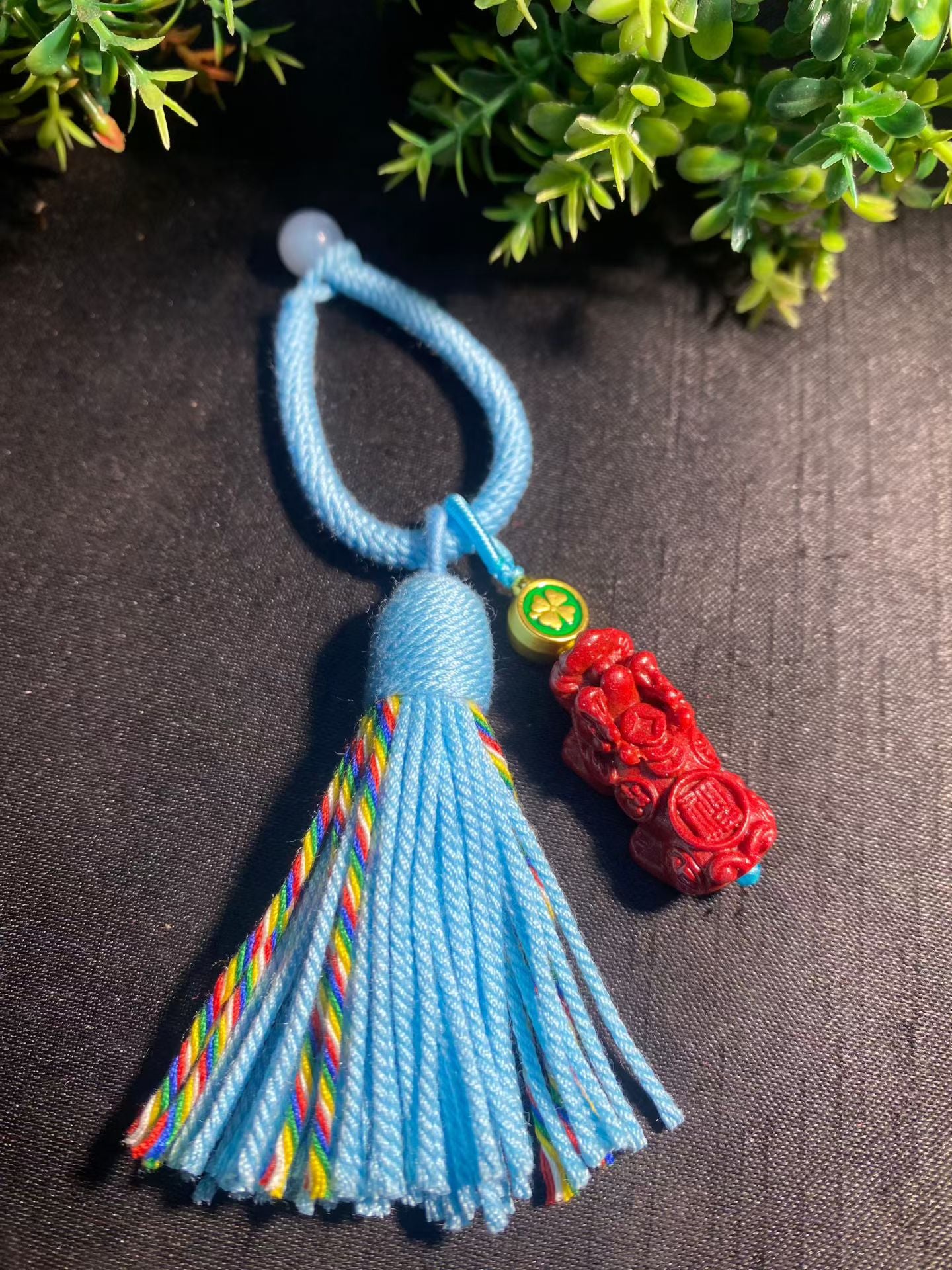 Natural cinnabar keychain bag hanging.