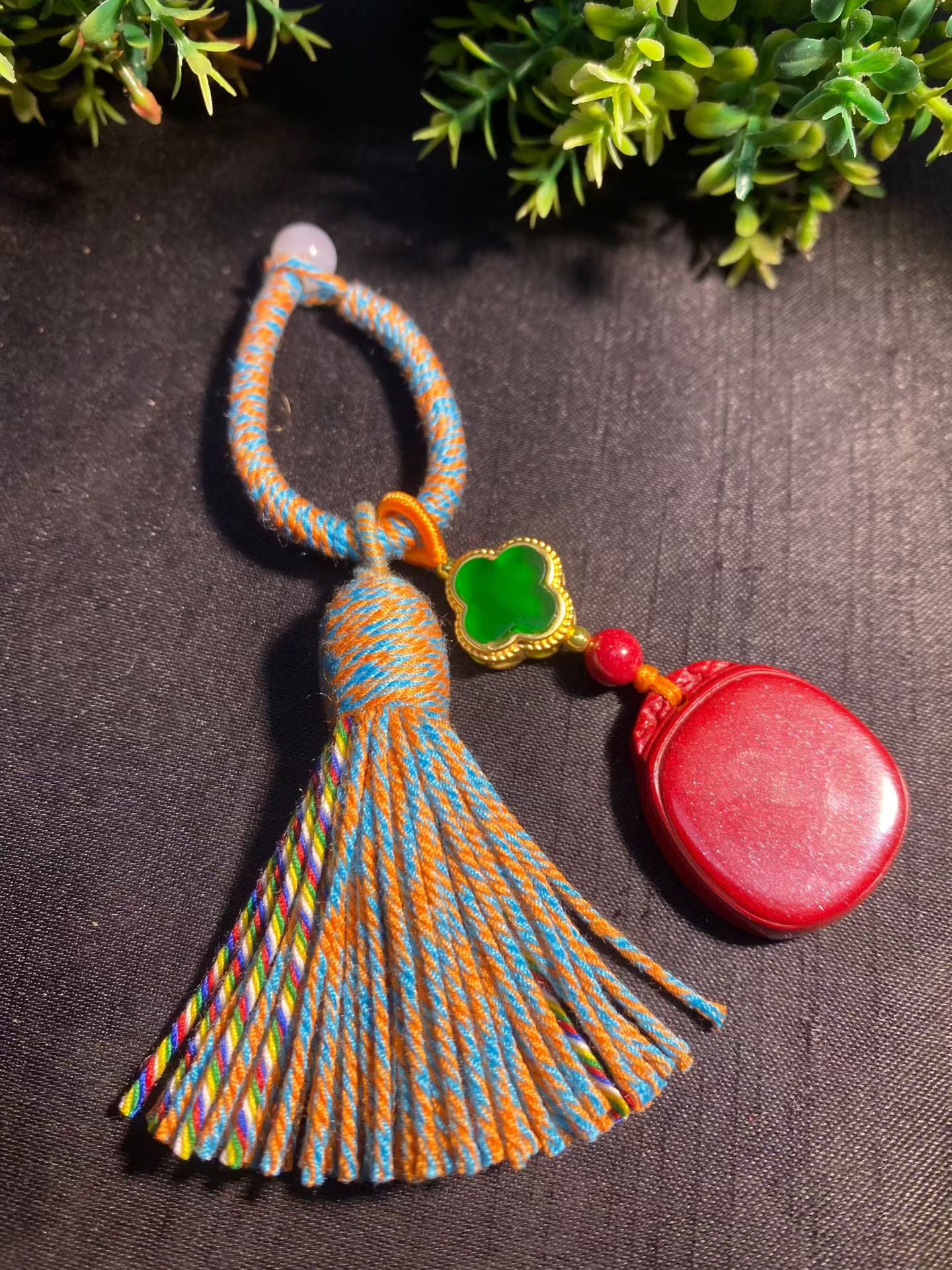 Natural cinnabar keychain bag hanging.